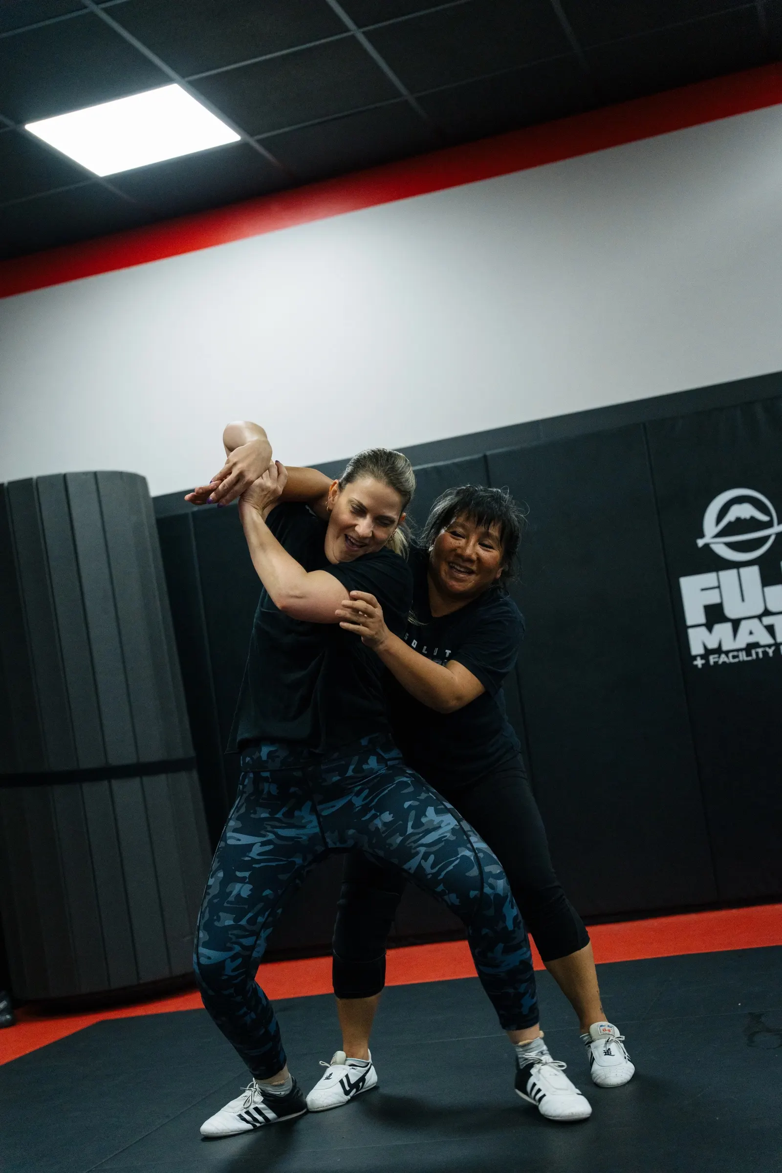 Trish leading a partner drill in class